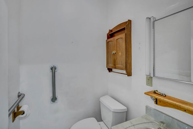 7493 S Saginaw St, New Lothrop, MI 48460 - bathroom featuring toilet and vanity