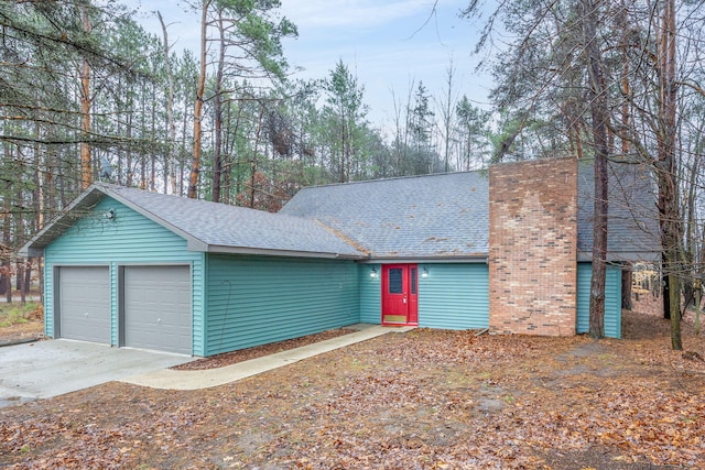 ranch-style home featuring a garage