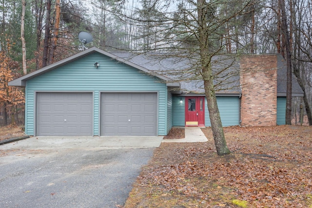 ranch-style home with a garage