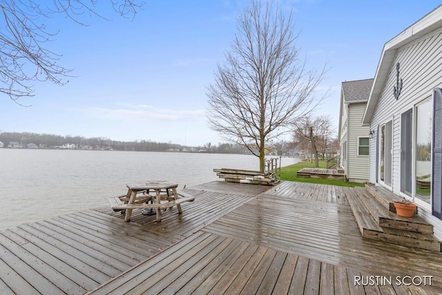 2008 Parker Dr, Wayland, MI 49348 - wooden deck with a water view and a boat dock