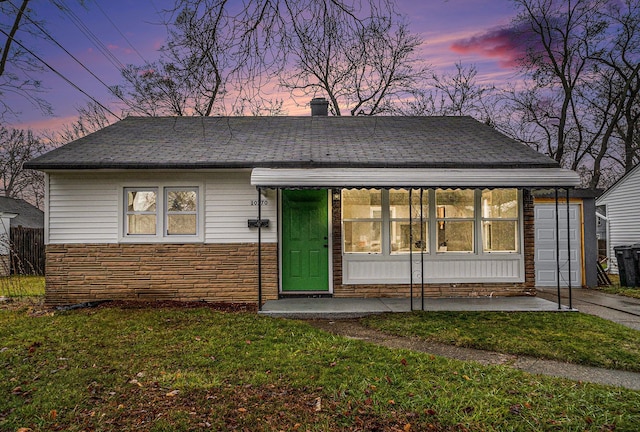 view of front of home with a yard