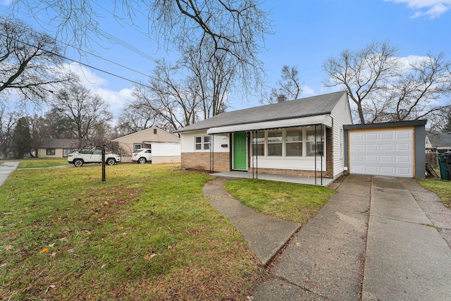 ranch-style home with a garage and a front lawn