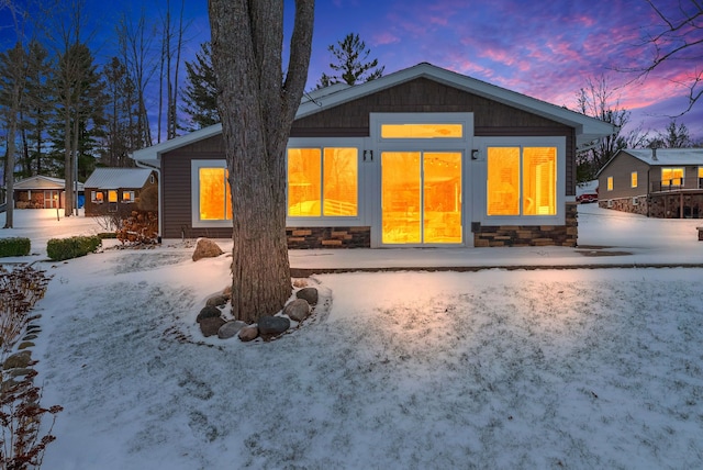 view of snow covered house