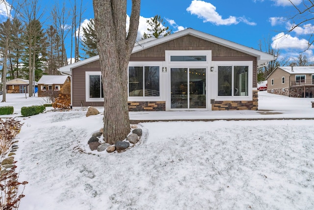 view of snow covered house