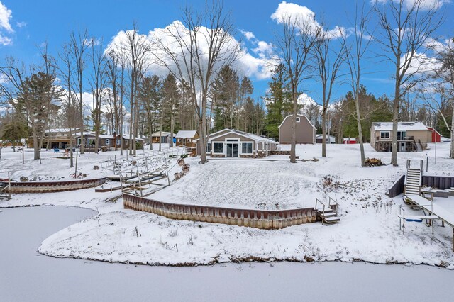 1571 Loebrich Dr, Gladwin, MI 48624 - snowy yard featuring an outdoor structure