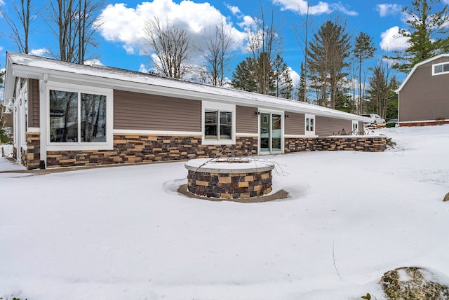 view of snow covered house