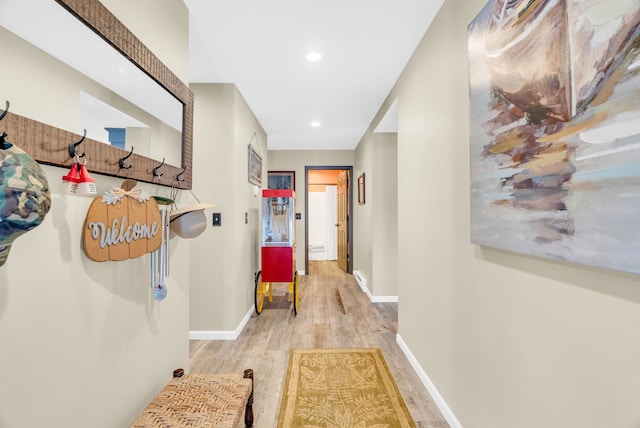 hallway with light hardwood / wood-style flooring