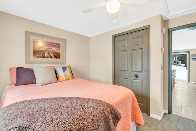 carpeted bedroom featuring ceiling fan