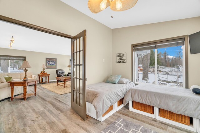 1571 Loebrich Dr, Gladwin, MI 48624 - bedroom with light wood-style flooring and access to outside
