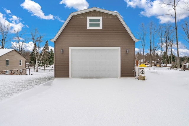 view of snow covered garage