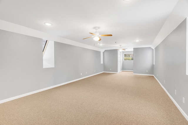 carpeted empty room featuring ceiling fan