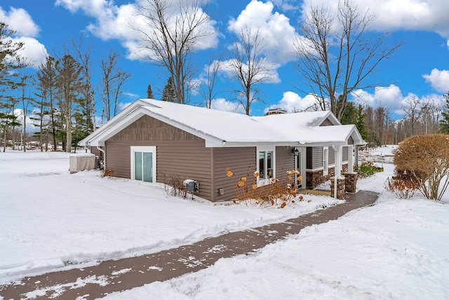 1571 Loebrich Dr, Gladwin, MI 48624 - view of snow covered exterior featuring a chimney