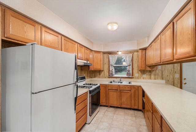 kitchen with sink and white appliances