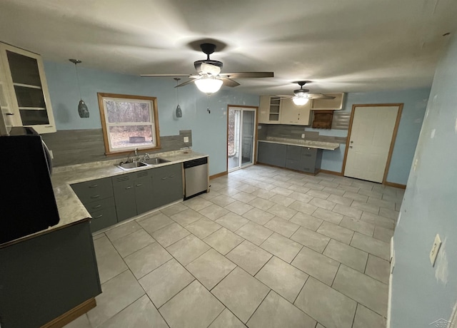 kitchen with tasteful backsplash, stainless steel dishwasher, gray cabinetry, ceiling fan, and sink