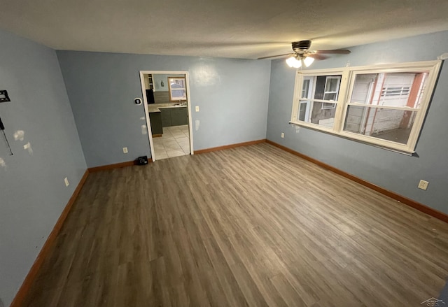 empty room featuring light hardwood / wood-style floors and ceiling fan