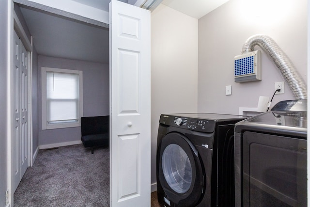 clothes washing area featuring dark colored carpet and separate washer and dryer