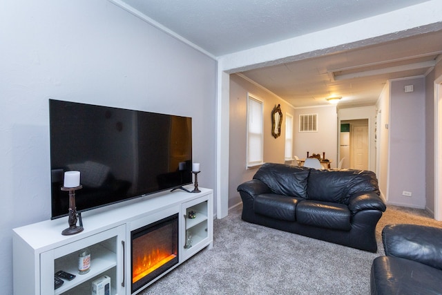 living room featuring light carpet and ornamental molding