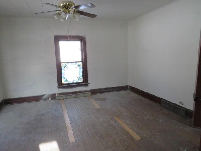 unfurnished room with ceiling fan and hardwood / wood-style floors