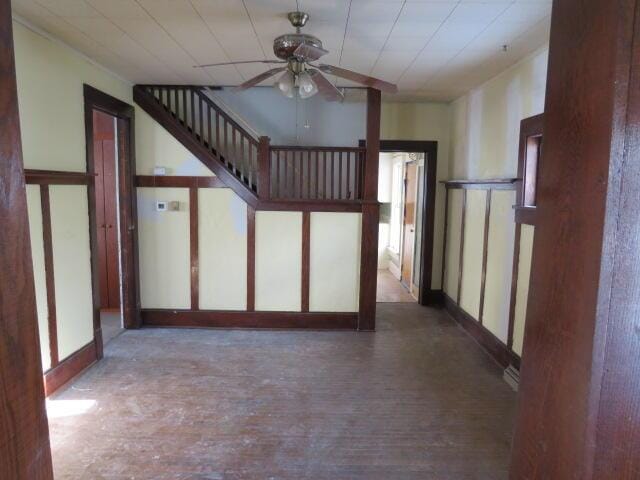 interior space with hardwood / wood-style floors and ceiling fan