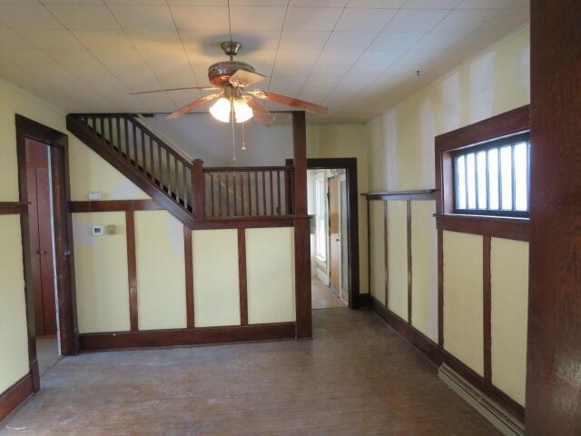 stairs with ceiling fan