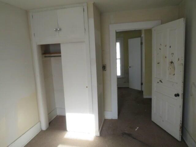 unfurnished bedroom with a closet