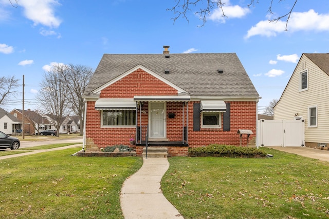 bungalow-style house featuring a front yard