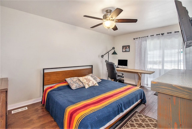 bedroom featuring ceiling fan and dark hardwood / wood-style floors