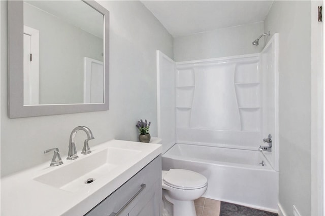 full bathroom with toilet, vanity, tile patterned floors, and shower / washtub combination