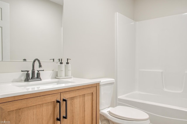 full bathroom with shower / bathing tub combination, vanity, and toilet