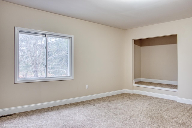 view of carpeted spare room