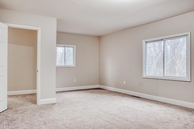 unfurnished bedroom with light carpet