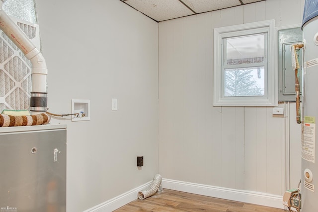 laundry area featuring washer hookup, hardwood / wood-style flooring, electric dryer hookup, and wood walls