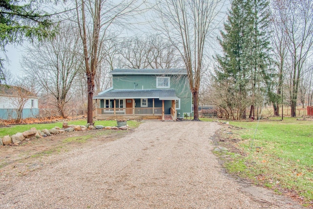 view of front facade with a front yard and a porch