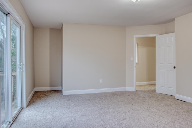 empty room featuring light colored carpet