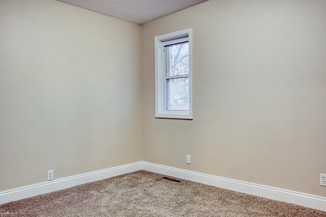 empty room featuring carpet floors