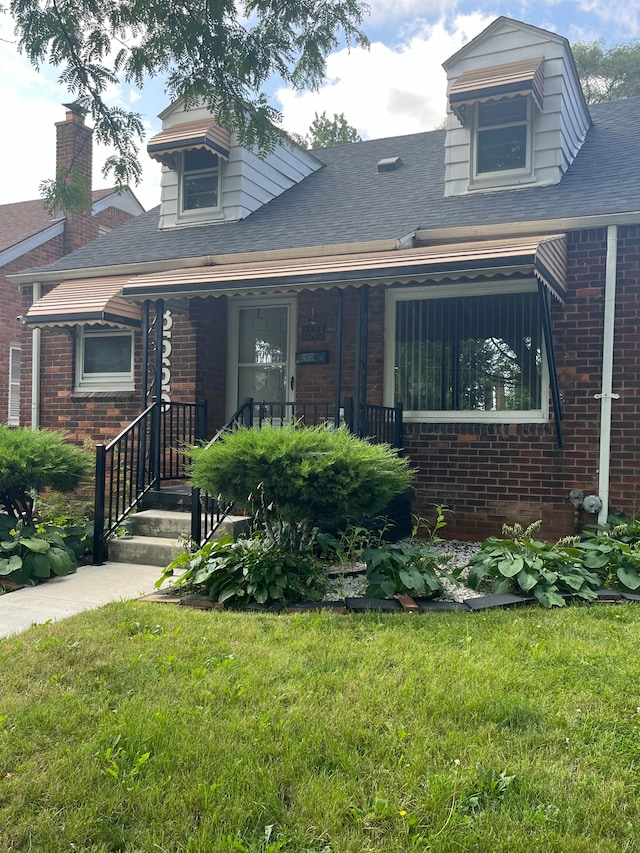 view of front of home with a front yard