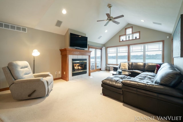 585 Crescent Dr, Holland, MI 49423 - carpeted living area with high vaulted ceiling, ceiling fan, and visible vents