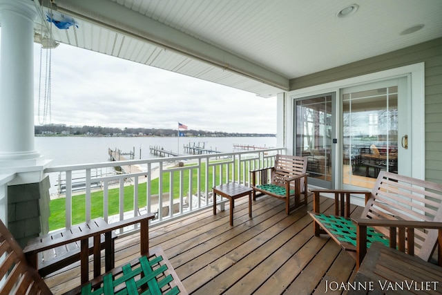 585 Crescent Dr, Holland, MI 49423 - deck featuring a water view, a yard, and boat lift