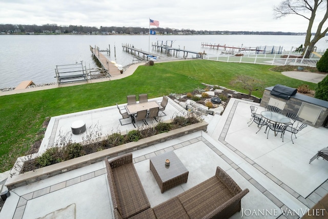 585 Crescent Dr, Holland, MI 49423 - view of patio / terrace featuring a water view, boat lift, a boat dock, fence, and outdoor dining area
