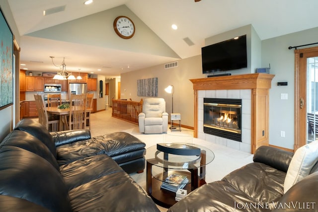 585 Crescent Dr, Holland, MI 49423 - living area featuring baseboards, a tiled fireplace, visible vents, and recessed lighting