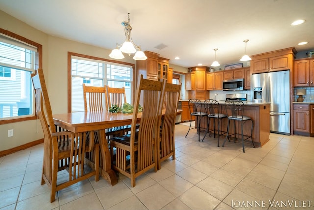 585 Crescent Dr, Holland, MI 49423 - dining room with light tile patterned floors, baseboards, recessed lighting, and a notable chandelier