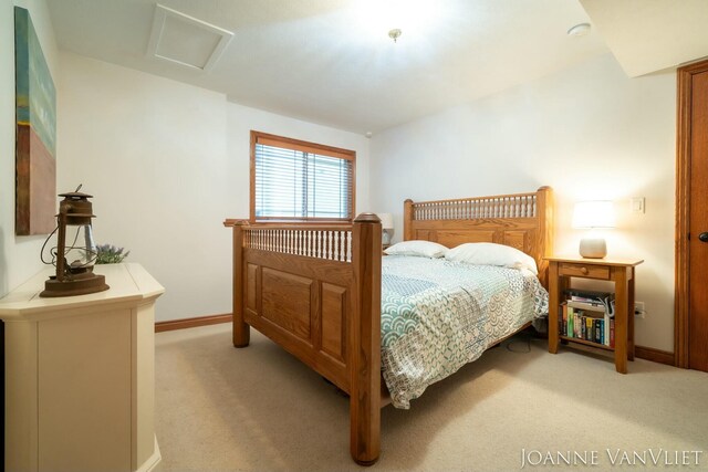 585 Crescent Dr, Holland, MI 49423 - bedroom featuring light carpet, attic access, and baseboards