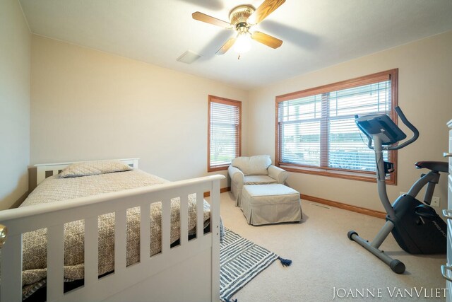 585 Crescent Dr, Holland, MI 49423 - bedroom with carpet flooring, baseboards, and a ceiling fan