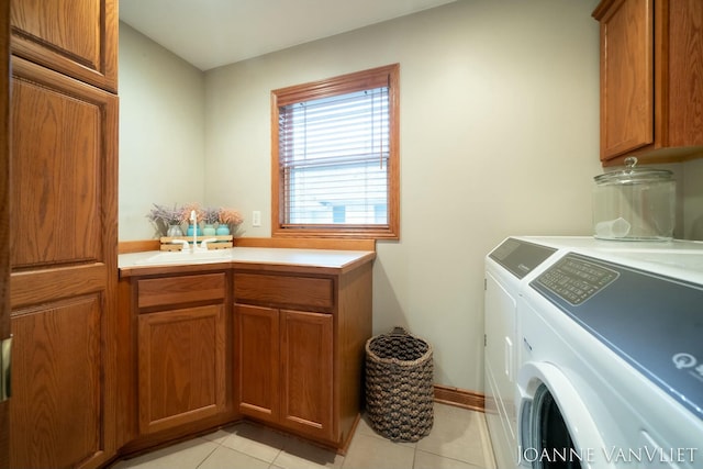 585 Crescent Dr, Holland, MI 49423 - clothes washing area with light tile patterned floors, separate washer and dryer, a sink, and cabinet space