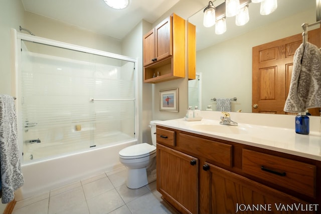 585 Crescent Dr, Holland, MI 49423 - full bath featuring toilet, tile patterned floors, vanity, and combined bath / shower with glass door