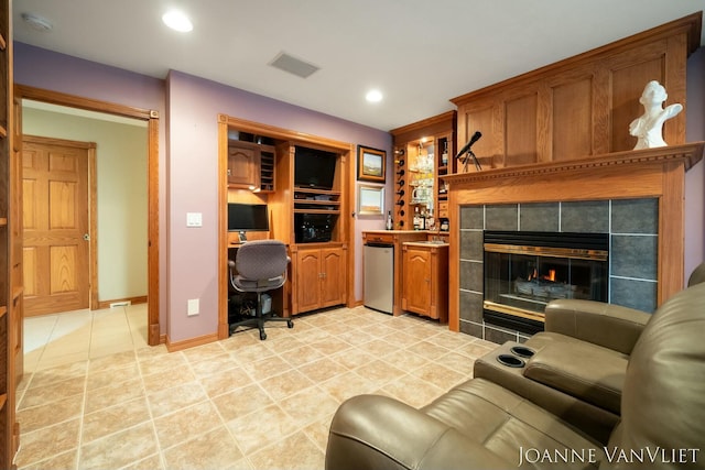 585 Crescent Dr, Holland, MI 49423 - living room featuring light tile patterned floors, visible vents, recessed lighting, a tiled fireplace, and baseboards