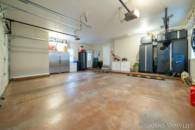 585 Crescent Dr, Holland, MI 49423 - garage with stainless steel refrigerator and a garage door opener