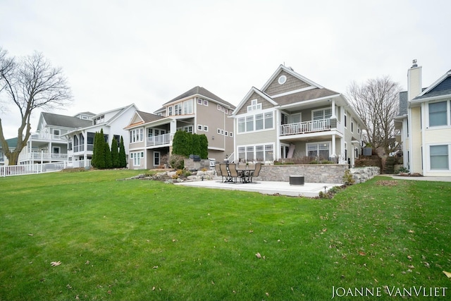 585 Crescent Dr, Holland, MI 49423 - rear view of house featuring a patio and a lawn