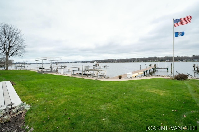 585 Crescent Dr, Holland, MI 49423 - dock area with boat lift, a yard, and a water view
