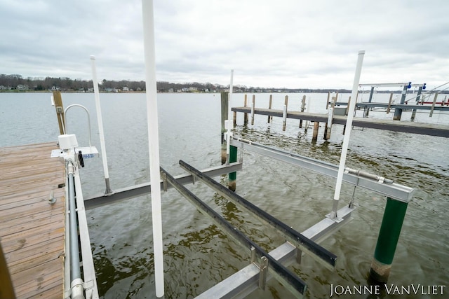 585 Crescent Dr, Holland, MI 49423 - dock featuring boat lift and a water view